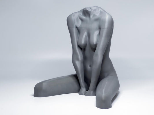 Seated female figure sculpture designed for artists studying anatomy, proportion, and grounded poses.