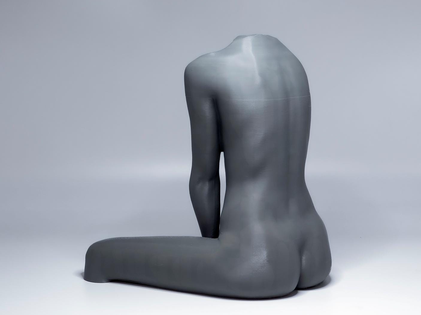 Seated female figure sculpture designed for artists studying anatomy, proportion, and grounded poses.