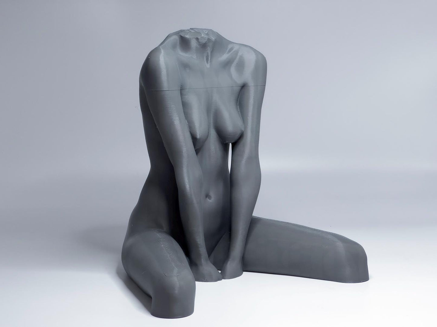 Seated female figure sculpture designed for artists studying anatomy, proportion, and grounded poses.