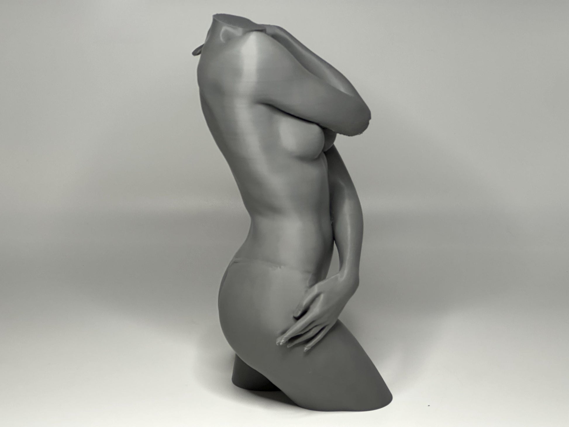Female seated anatomy torso model for artists. Studio reference sculpture for studying shoulder overlap and structural balance.