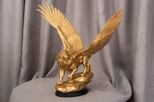Daniel 7 Winged Lion Statue inspired by the prophetic vision in the Book of Daniel. High-detail resin sculpture in Gold or Silver. Christian biblical decor.