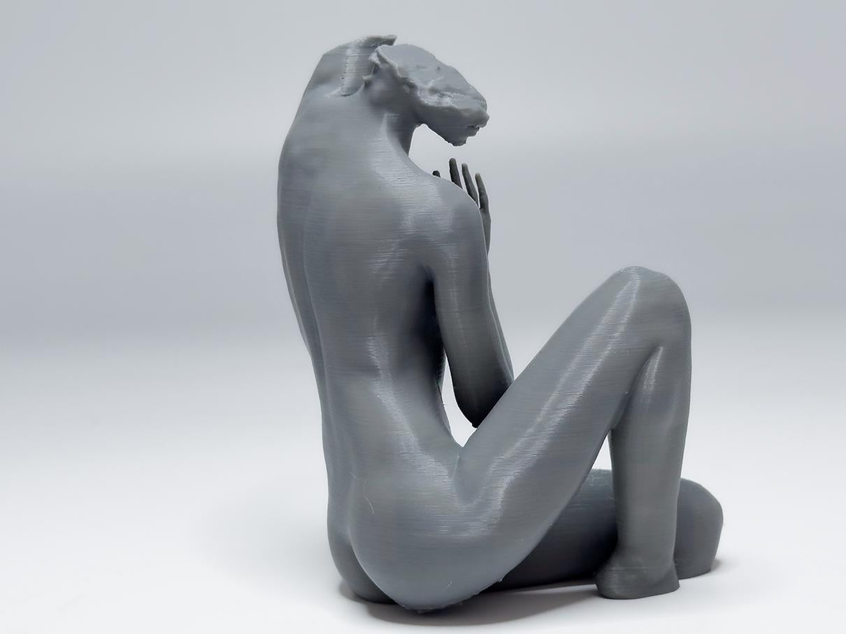 Female seated anatomy sculpture with raised arm for artists. Figure drawing reference model for studying stretch, proportion, and light.