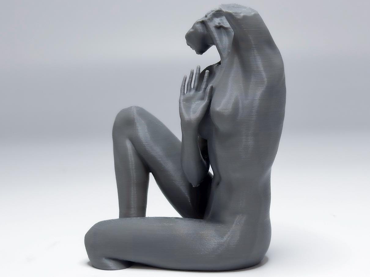 Female seated anatomy sculpture with raised arm for artists. Figure drawing reference model for studying stretch, proportion, and light.