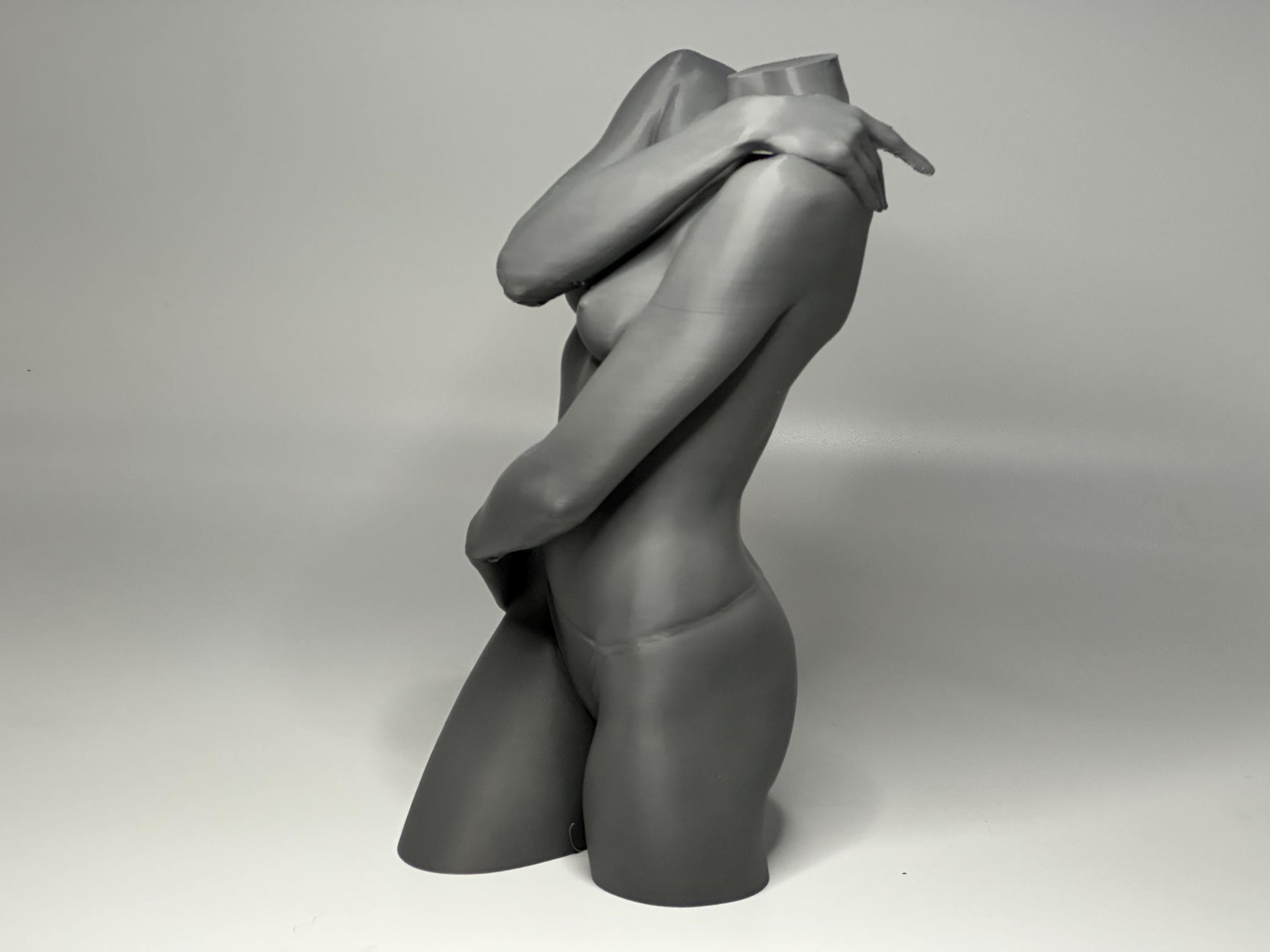 Female seated anatomy torso model for artists. Studio reference sculpture for studying shoulder overlap and structural balance.