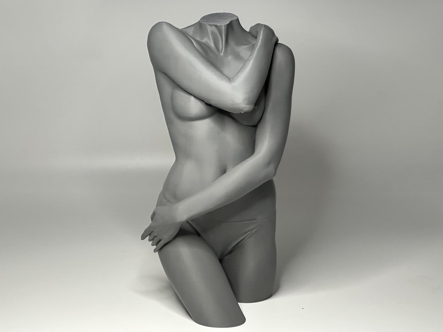 Female seated anatomy torso model for artists. Studio reference sculpture for studying shoulder overlap and structural balance.