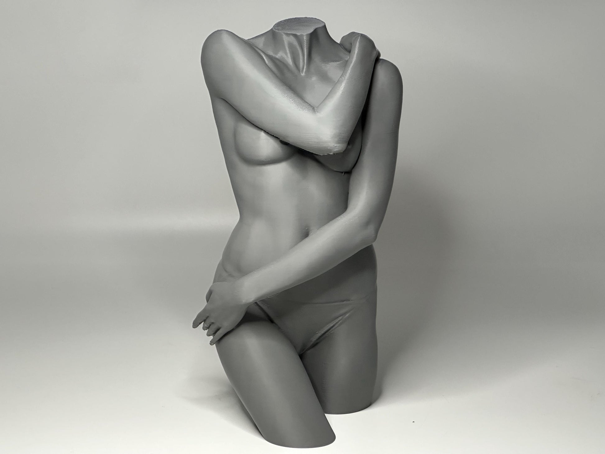Female seated anatomy torso model for artists. Studio reference sculpture for studying shoulder overlap and structural balance.