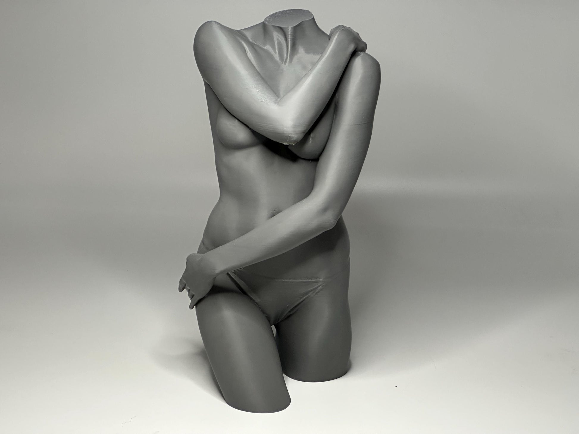 Female seated anatomy torso model for artists. Studio reference sculpture for studying shoulder overlap and structural balance.
