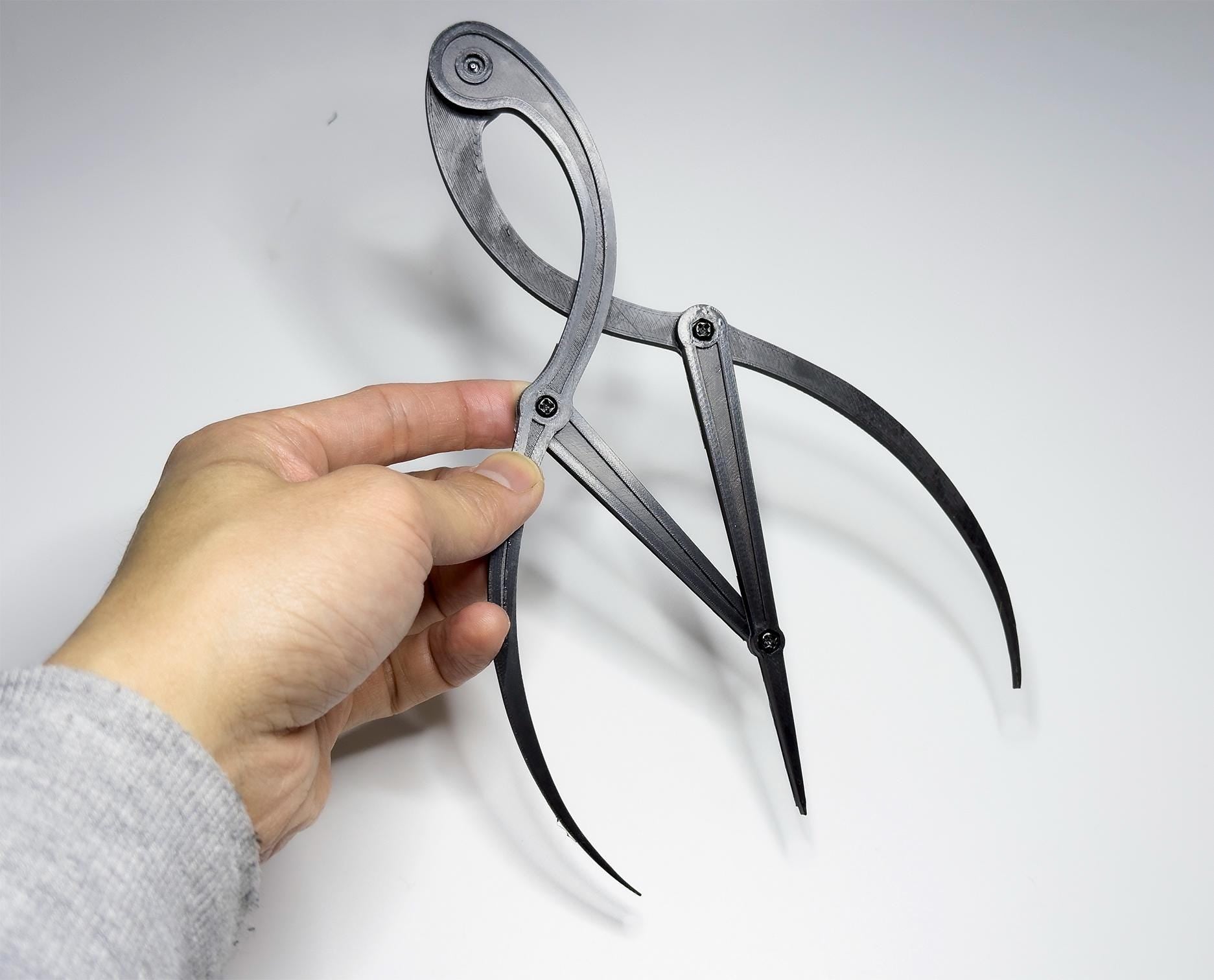 Artist golden ratio caliper for accurate proportional measurement in drawing, painting, and sculpture. Ready to use, worldwide shipping.