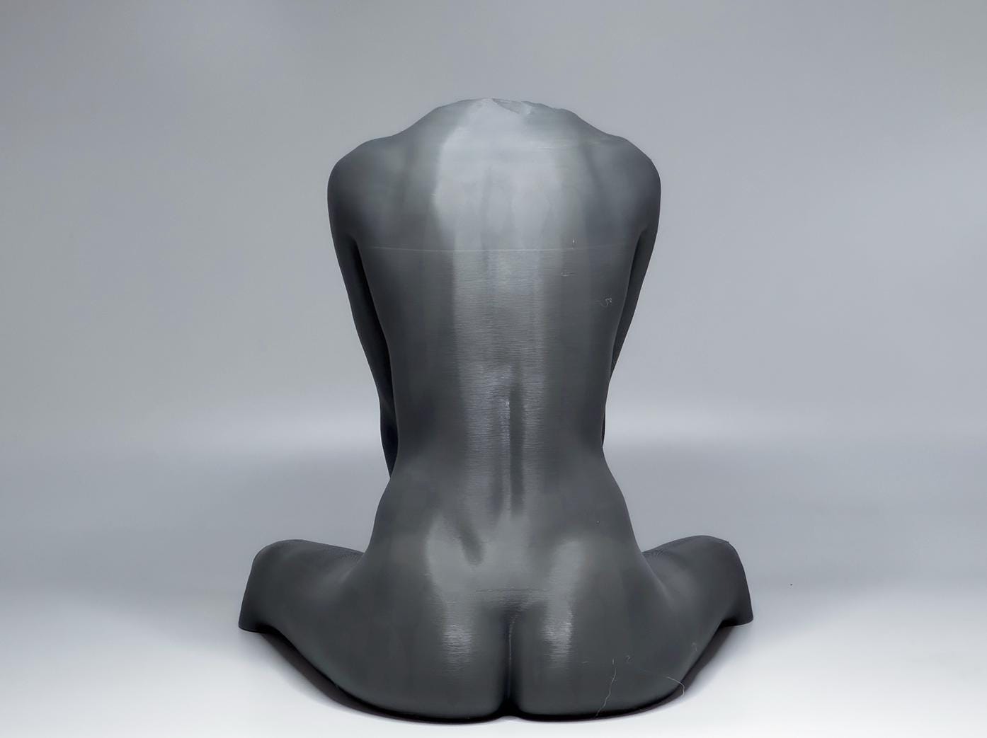 Seated female figure sculpture designed for artists studying anatomy, proportion, and grounded poses.